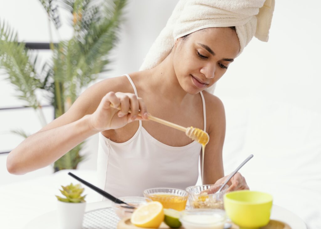 Lemon and honey being mixed for a natural mask